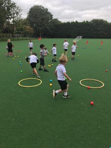 Children playing outdoor games at Inchmarlo, promoting active learning and development.