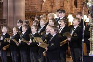 Students performing in choir at Inchmarlo School, showcasing musical talent and extracurricular activities.