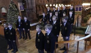 Young students in formal uniforms at Inchmarlo School celebration.
