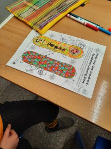 Colorful activity sheet with children’s drawings and crafts.