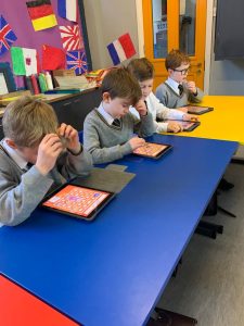 Children using tablets in classroom at Inchmarlo School.