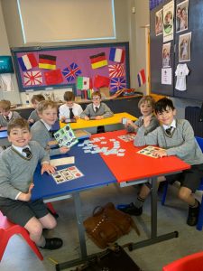 Primary school children engaged in classroom activities in Inchmarlo, highlighting quality education.
