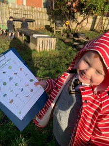 Young girl exploring outdoor gardens at Inchmarlo, enjoying nature and learning.