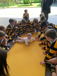 Children playing and learning at Inchmarlo nursery school in a lively outdoor setting.