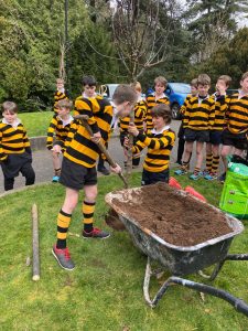 Children gardening at Inchmarlo outdoor activity center in Aberdeenshire.