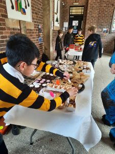 Students enjoying a school fair with baked goods and crafts at Inchmarlo school.