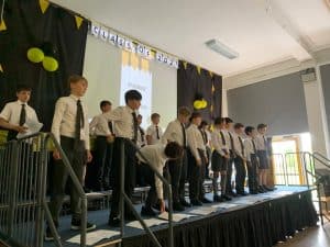 Students performing on stage at Inchmarlo.