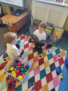 Children playing with educational toys at Inchmarlo care facility.