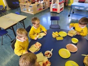 Young children enjoying lunch at Inchmarlo nursery classroom.