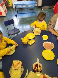 Children enjoying breakfast at Inchmarlo nursery in a vibrant learning environment.