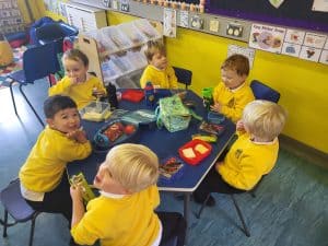 Young children engaging in classroom activities at Inchmarlo preschool.
