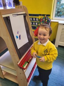 Boy playing with educational toys at Inchmarlo Early Learning Center.