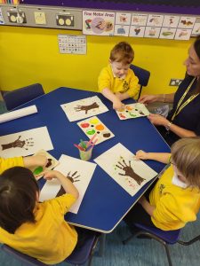 Children engaging in art activities at Inchmarlo preschool.