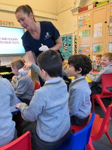 Children engaging in interactive learning at Inchmarlo School.
