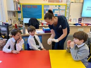 Young children participating in fun classroom activity at Inchmarlo nursery.