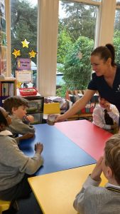 Young children engaging with staff in a colorful activity room at Inchmarlo.