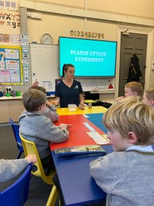 Young students engaging in a science experiment at Inchmarlo School.