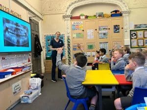 Engaging classroom scene with students and teacher, promoting quality education at Inchmarlo.