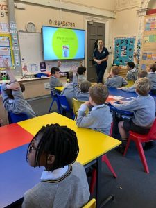 Primary school children learning in a modern classroom setting.
