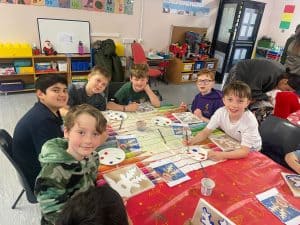 Students enjoying fun educational activities at Inchmarlo school classroom.