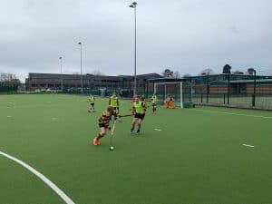 Children playing soccer on Inchmarlo sports field in Scotland.