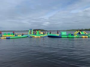 Vibrant inflatable water slide at Inchmarlo estate, perfect for fun family outdoor activities.