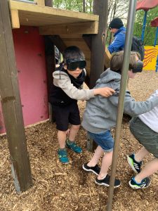 Children playing at Inchmarlo outdoor playground in Scotland.