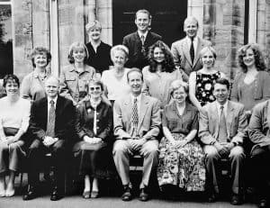 Group of elderly residents and staff at Inchmarlo Care Home in a warm, welcoming setting.