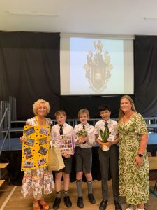 Young students receiving awards at Inchmarlo School event.