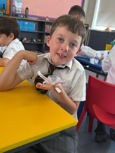 Young boy enjoying classroom activities at Inchmarlo School, emphasizing a nurturing learning environment.