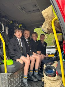 Students in uniform inside a school bus at Inchmarlo.