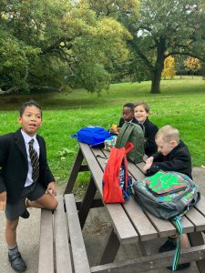Group of children enjoying outdoor at Inchmarlo estate, Scotland.