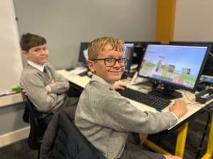 Students working on computers at Inchmarlo school.