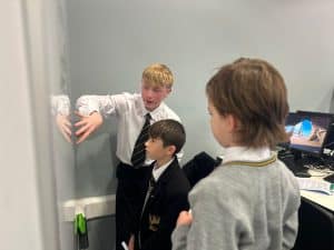 Students engaging in classroom activity at Inchmarlo School, emphasizing quality education and student development.