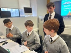 Students engaging in classroom discussion at Inchmarlo School.