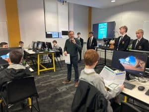 Students engaged in a modern technology classroom at Inchmarlo, focusing on digital skills and classroom innovation.