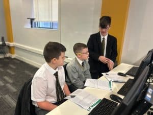 Students engaging in classroom activity at Inchmarlo School, focusing on academic excellence.