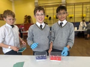 Students conducting science experiments at Inchmarlo School.