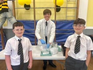 Students presenting science projects at Inchmarlo school.