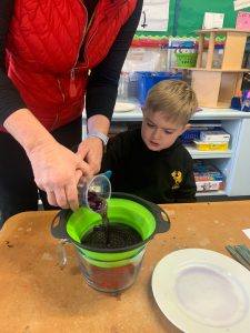 Child engaging in fun activity at Inchmarlo care center.