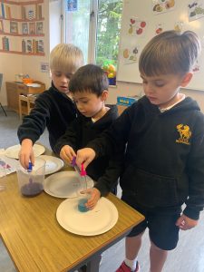 Young children engaging in creative art activity at Inchmarlo School.