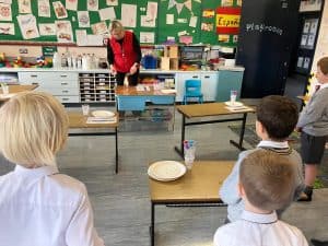 Young children engaging in a classroom activity at Inchmarlo Nursery.