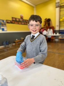 Young boy engaging in fun activity at Inchmarlo childcare.