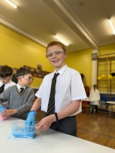 Happy student in classroom setting at Inchmarlo school.