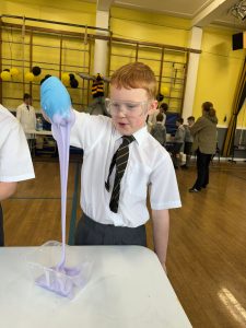 Young boy conducting science experiment at Inchmarlo school.