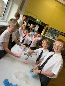 Children conducting fun science experiments at Inchmarlo school.