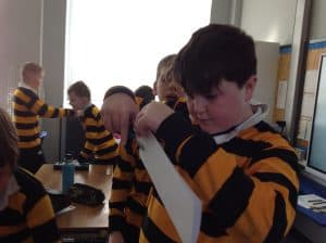 Children working on a computer in a classroom.