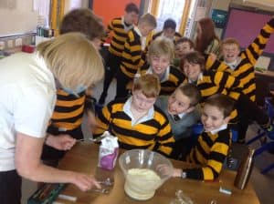 Children learning to cook at Inchmarlo in a fun, educational environment.