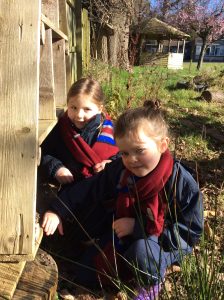 Children exploring outdoors at Inchmarlo estate in Scotland.