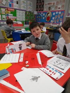 Bright classroom with engaged students working on activities.